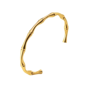 Minimalist gold bamboo joint open bangle bracelet with a high-polished metallic finish