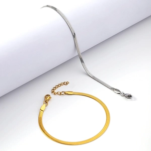 Flat snake bone chain bracelet set in gold and silver stainless steel with lobster clasp