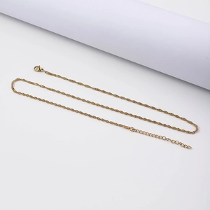 Detail of 18K gold-plated twisted wave chain necklace with lobster clasp and extender