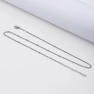 Detail of 18k gold plated stainless steel curb chain with lobster clasp and extender