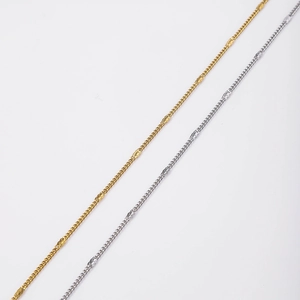 Detailed close-up of 18k gold and silver stainless steel curb chain with rectangular links