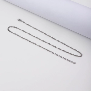 Detail of silver water wave chain necklace showing lobster clasp and extender links