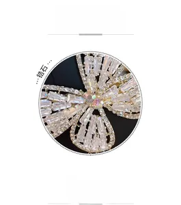 Detail shot of a large metal butterfly hair clip with full crystal zircon embellishments