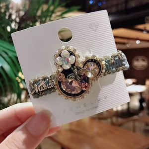 Sparkling pink crystal Mickey hair clip with pearl and bee accents on blue tweed band