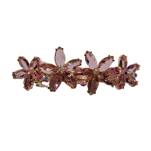 Elegante molletta per capelli floreale con cristalli viola e base in metallo dorato