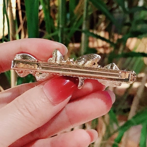 Back view of a gold-plated crystal butterfly hair clip showing strong metal duckbill grip