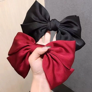 Eleganti fermagli per capelli con fiocco in raso nei colori nero e rosso vino