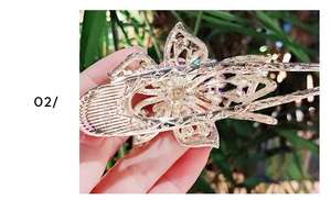 Detail of vintage flower hair comb with colorful aurora borealis rhinestones