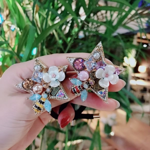 Handmade hair ties with baroque pearls, crystals, colorful bees, and white floral charms