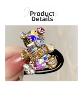 Detailed close-up of a high-elastic hair tie with a colorful crystal-embellished bear charm