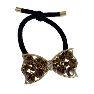 Sparkling rhinestone bow hair tie with maroon crystal and golden metal frame details