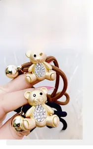Detail of high-elasticity hair ties with crystal rhinestone bear charms and small bells