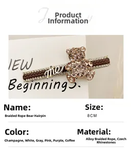 Close-up of 8cm rhinestone bear hair clip with woven rope texture and metal me tag