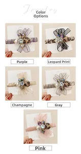 Detail view of five colors of rhinestone organza bow hair clips with pearls and leopard balls