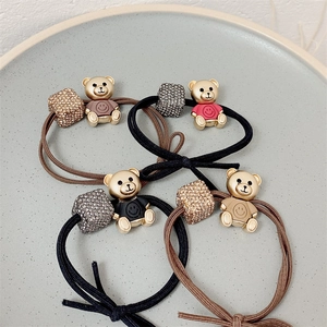 Elastic bear hair ties with gold charms and sparkling crystal beads in four colors