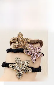 Vue détaillée des élastiques cheveux étoile de mer en strass, coloris champagne et lilas