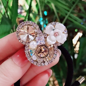 Baroque crystal hair tie featuring a sparkling mouse head shape with pearls and camellia