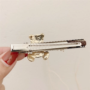 Cute alloy bear hair clip with rhinestones and brown woven detail on metal duckbill base