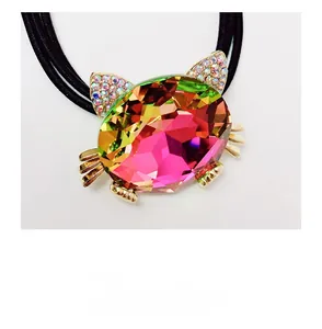 Macro shot of a cat-shaped crystal hair tie with vibrant rhinestones and triple elastic bands