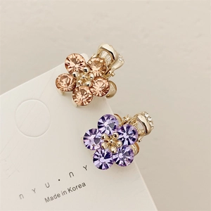Set of 2 mini crystal flower hair claws in champagne and lavender on a gold base