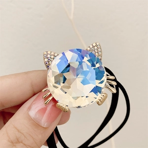 Cute cat-shaped hair tie with large iridescent crystal and gold rhinestone details