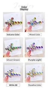 Detail of six colorful crystal butterfly hair clips in a gold-toned alloy setting