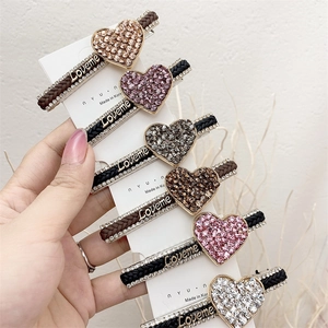 Set of six heart-shaped rhinestone hair clips with woven texture and Loveme metal logo