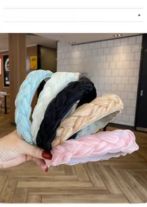 Detail showing five colors of organza braided headbands in blue, beige, black, and pink