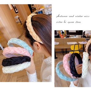 Close-up of wide braided headbands in five colors with soft organza fabric texture