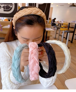 Detailed braided organza headbands in beige, blue, pink, and cream with soft texture
