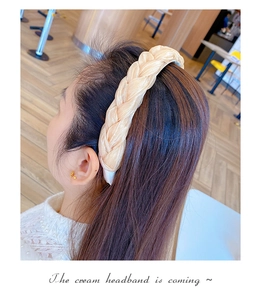 Detail view of cream organza braided headband with silk finish and non-slip inner grip