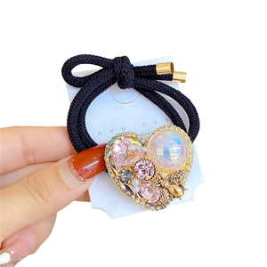Double-strand elastic hair tie with a heart rhinestone charm and golden bee detail