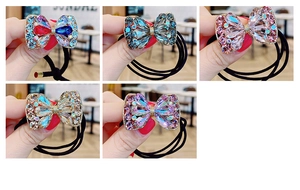 Vue détaillée d'élastiques à cheveux nœuds avec strass étincelants de diverses couleurs