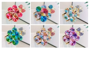Detailed macro view of colorful crystal flower hair clips with rhinestones in six colors