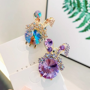 Luxurious rabbit shaped hair clips with sparkling crystals and rhinestones in blue and purple