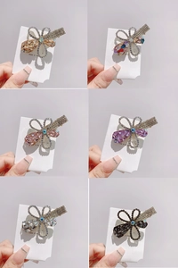 Detailed macro view of rhinestone flower hair clips in various elegant colors