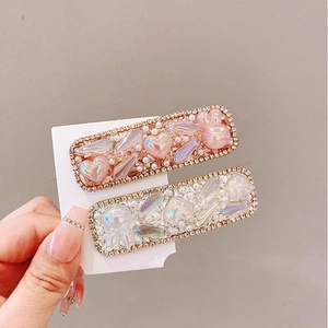 Sparkly heart hair clip with pink and iridescent white rhinestones and cute bunny detail