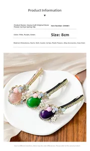 Detailed close-up of 8cm floral spring hair clip with emerald cat eye stones and pearls