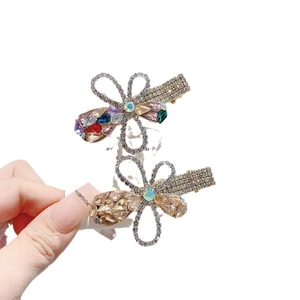 Floral crystal hair clips set in vibrant colors for elegant styling and french side pinning