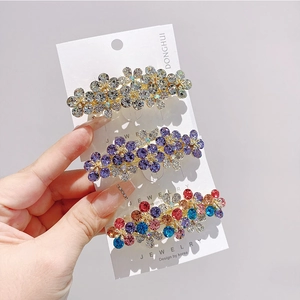 Set di tre fermagli per capelli a fiore con strass grigi viola e cristalli colorati