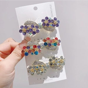 Three-piece Korean rhinestone flower hair clip set with gold alloy finish and crystals