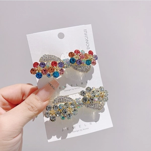 Elegant gold metal hair clips set with colorful rhinestones and delicate flowers