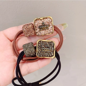 Korean style high elastic hair rope with rhinestone heart charms for women in black and brown