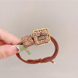 Brown high-elasticity hair tie with sparkling rhinestone heart and gold metal accents