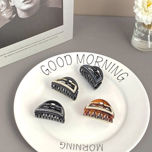 Set aus vier minimalistischen kleinen Haarklammern mit Strasssteinen in Schwarz und Bernstein