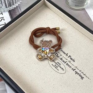 Élastique à cheveux marron avec pendentif ours en strass et cœur en cristal brillant