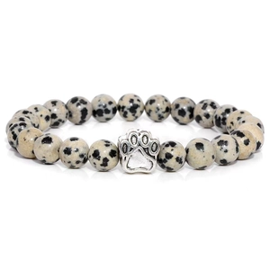 Detail of 10mm Dalmatian Jasper beaded bracelet with silver dog paw print charm