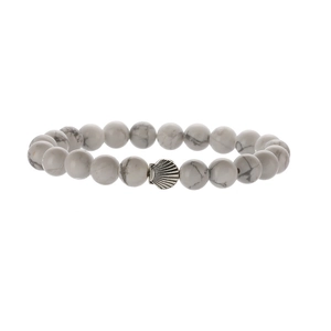 Detailed macro shot of white howlite beads and silver shell charm on handmade bracelet