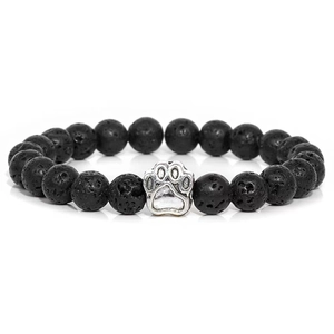 Close-up of 10mm black lava stone beads and a silver paw print charm on elastic bracelet