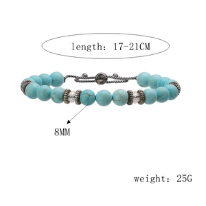 Detail view of 8mm turquoise beads bracelet with 17-21cm adjustable braided cord